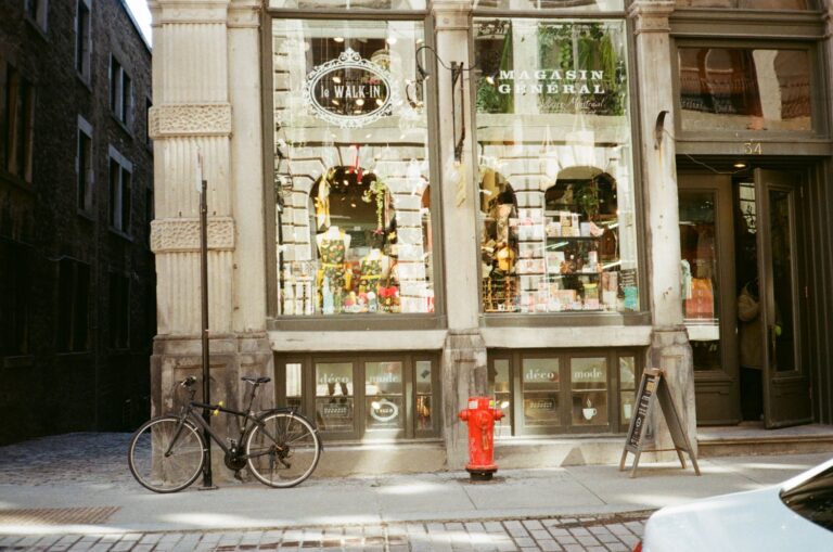 Shop sign cost: boutique storefront with a fascia sign above the shop entrance on a UK street